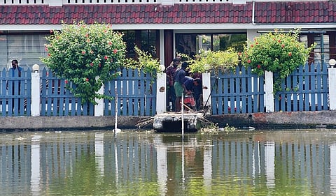 The Kochi Corporation workers demolishing the boat jetty which was constructed illegally adjacent to actor Jayasurya’s House in the Chlavannoor backwaters in Kochi on Wednesday | Albin Mathew