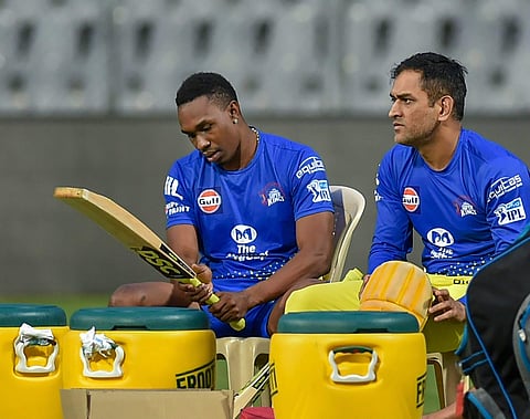 Chennai Super Kings players Dwayne Bravo and MS Dhoni during a practice session ahead of IPL 2018 in Mumbai (File | PTI)