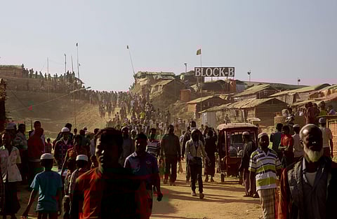 FILE - In this Jan. 28, 2018, file photo, Rohingya refugees come out of their homes after the visit of Indonesian President Joko 'Jokowi' Widodo at Jamtoli refugee camp near Cox's Bazar, Bangladesh. | AP