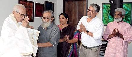 Critic M K Sanu being honoured by actor/writer P Balachandran, director Shymaprasad and actor Sandhya Rajendran -- all disciples of playwright and director G Sankara Pillai -- at Nanappa Art Gallery on Sunday. A Sanesh