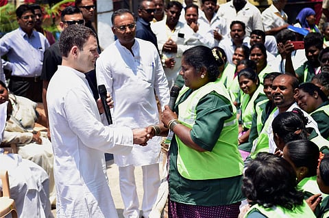 Congress president Rahul Gandhi during a interaction with pourakarmikas on the last day of his Jana Aashirwada Yatre in Bengaluru. | PTI