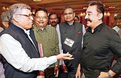 Kamal Haasan interacting with S Gurumurthy during FICCI national conclave in the city on Wednesday | Express