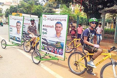 Supporters of Minister Krishna Byregowda taking out a green campaign