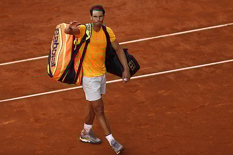 Rafael Nadal from Spain leaves the court after losing to Dominic Thiem from Austria at the end of a Madrid Open tennis tournament match in Madrid. (AP)