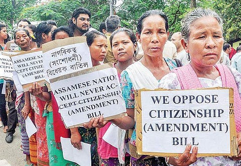 Members of different organisations hold placards against a Joint Committee hearing on the Citizenship (Amendment) Bill at the Assam Administrative Staff College, Khanapara, in Guwahati | PTI