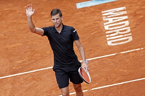 Dominic Thiem from Austria celebrates his victory over Kevin Anderson from South Africa a during a Madrid Open tennis tournament semi final match in Madrid. (AP)