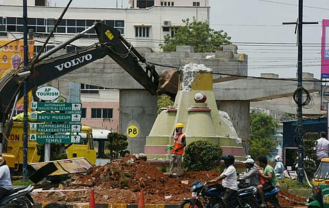Workers demolishing Benz Circle to make way for the construction of flyover in Vijayawada. Express Photo by P Ravindra Babu