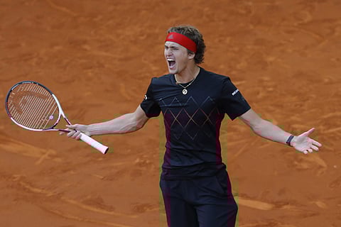 Alexander Zverev of Germany celebrates after defeating Dominic Thiem of Austria 6-4, 6-4 during the men's final of the Madrid Open. (AP)