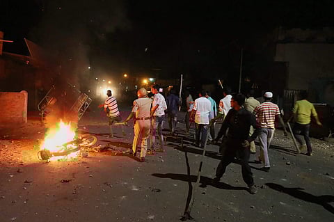 Rioters hurl stones and sticks during a communal riot that escalated due to clamping illegal water connection in a religious place in Moti Karanja area of Aurangabad on Friday, 11 May 2018. | PTI
