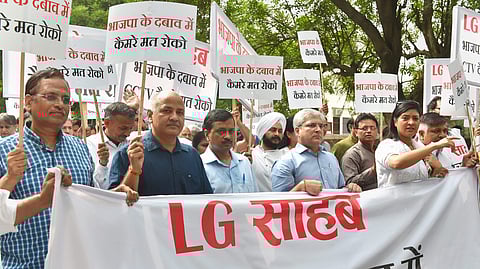 Delhi Chief Minister Arvind Kejriwal with Deputy CM Manish Sisodia and AAP MLAs march from his residence to the Lieutenant-Governor House to discuss the acrimony over the issue of setting up CCTV cameras in the city New Delhi on Monday. | PTI