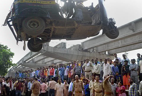 Rescue work underway after a portion of an under-construction flyover collapsed in Varanasi on Wednesday. | PTI