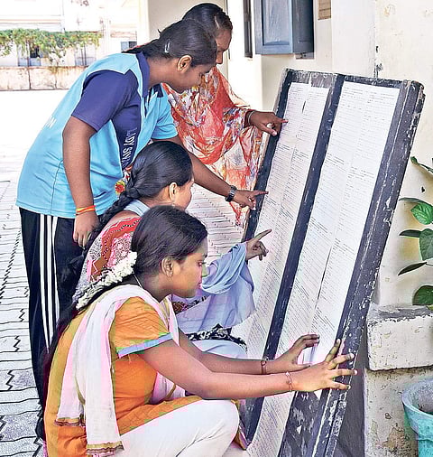 Students of Lady Sivasami School at Mylapore checking their Class XII results at the school on Wednesday | ASHWIN PRASATH