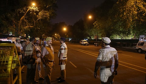 Media waiting outside the CJI residence in New Delhi on Wednesday night. (Express photo by Shekhar Yadav)