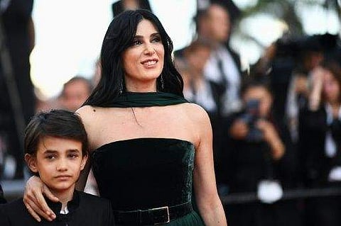 3-year-old Syrian refugee Zain Al Rafeea and Lebanese director Nadine Labaki on the red carpet. | AFP