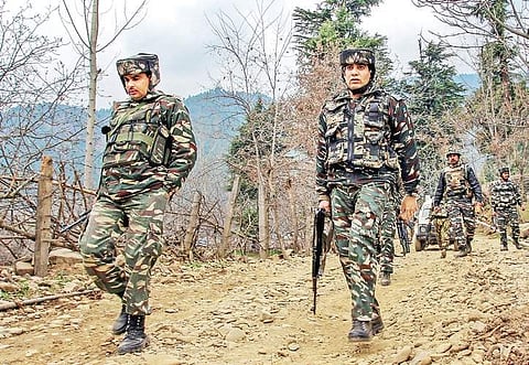 In this file photo, Security personnel move towards the spot where militants were hiding during an encounter in Kupwara district. (File | PTI)