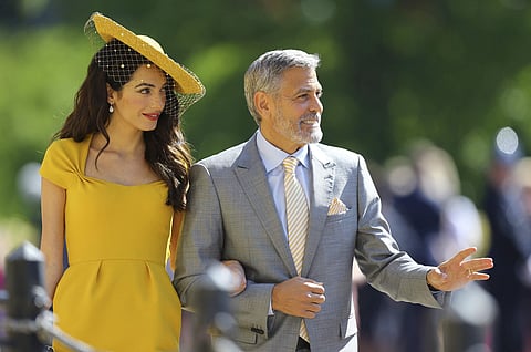 Amal Clooney and George Clooney arrive for the wedding ceremony of Prince Harry and Meghan Markle at St. George's Chapel in Windsor Castle. | AP
