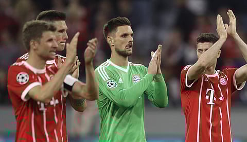 Bayern's Thomas Mueller, Niklas Suele, Sven Ulreich and Robert Lewandowski, from left, acknowledge the fans after losing 1-2 during the semifinal first leg soccer match between FC Bayern Munich and Real Madrid at the Allianz Arena stadium in Munich, Germa