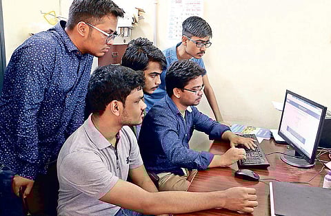 Students checking their Plus II Science result in Bhubaneswar.