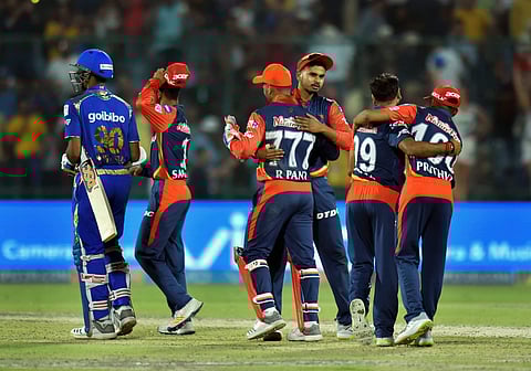 Delhi Daredevils players celebrate their victory over Mumbai Indians during an IPL T-20 match in New Delhi on Sunday. | PTI