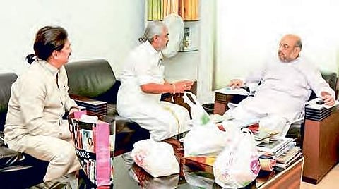 Former chief priest of Tirumala Temple Ramana Deekshitulu speaks with BJP president Amit Shah in New Delhi on Monday | Express