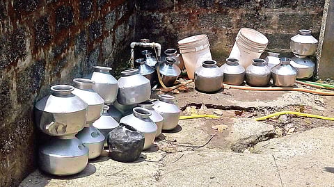 Vessels lined up in front of a public tap at Chellanam