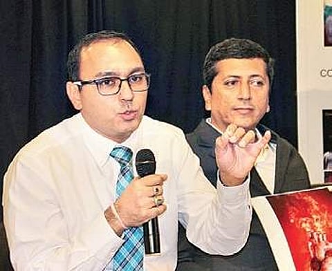 Oncologist Dr Vishal Rao U S addressing an event in the city on Friday | Express