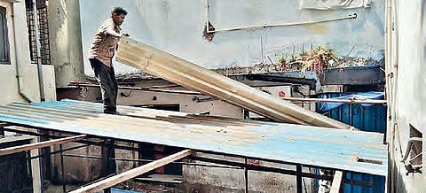 GHMC workers demolishing the structure of the restaurant on Saturday | Express