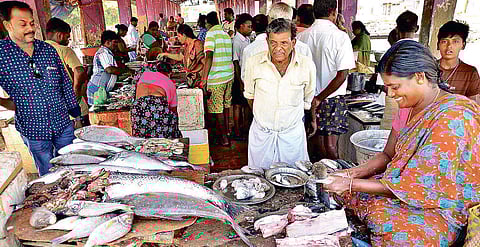 People at a fish market in Thoothukudi, where situation limped back to normalcy on Saturday | V KARTHIKALAGU