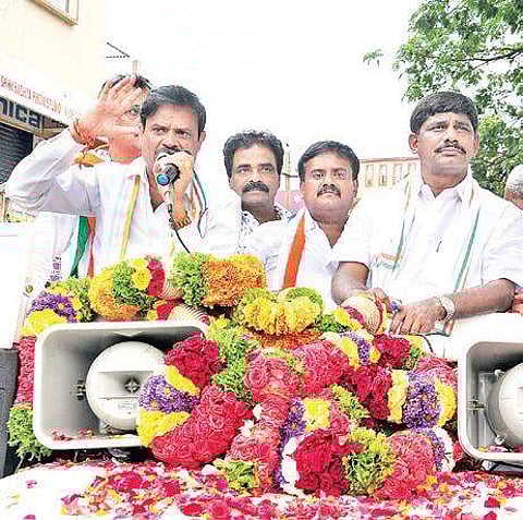 Congress candidate N Muniratna campaigns at Rajarajeshwar.