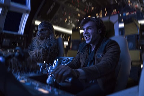 In this image released by Lucasfilm, Alden Ehrenreich, right, and Joonas Suotamo appear in a scene from 'Solo: A Star Wars Story.' (Jonathan Olley/Lucasfilm via AP)
