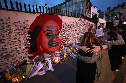 Candle and flowers are placed in front of a mural of Savita Halappanavar in Dublin | AP