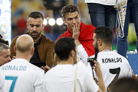 Cristiano Ronaldo, top right, chats with fans after winning the Champions League Final match between Real Madrid and Liverpool at the Olimpiyskiy Stadium in Kiev, Ukraine. | AP