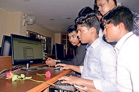 Class XII students checking their results on internet at a school. Image used for representation.