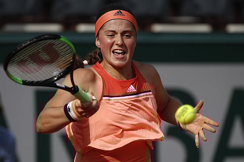 Jelena Ostapenko returns the ball to Kateryna Kozlova during their first round match of French Open tennis tournament at the Roland Garros Stadium. | AP