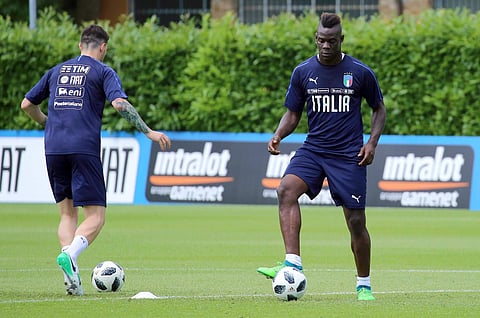 Italy forward Mario Balotelli, right, attends a training session at the Coverciano Sports Center, near Florence. | AP
