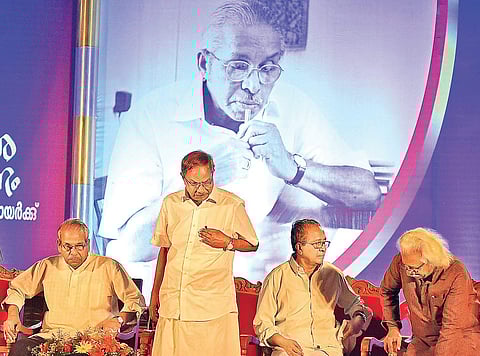 Writer M T Vasudevan Nair proceeding to speak after receiving the second ONV literary award at the Tagore Theatre in Thiruvananthapuram on Sunday. (From left)Writer C Radhakrishnan, critic M M Basheer and filmmaker Adoor Gopalakrishnan are also seen | B P