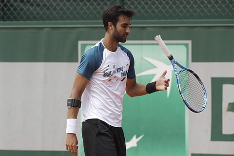 India's Yuki Bhambri juggles with his racket during the first round match of the French Open tennis tournament against Belgium's Ruben Bemelmans | AP