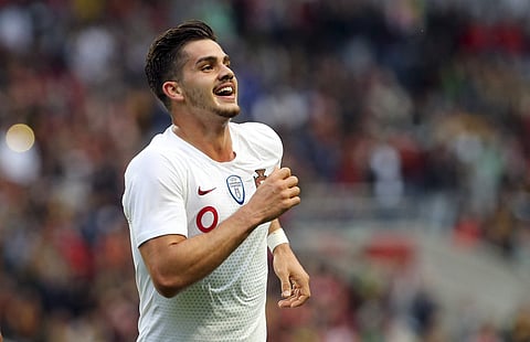 Portugal striker Andre Silva celebrates after scoring the opening goal during a friendly soccer match between Portugal and Tunisia in Braga. | AP