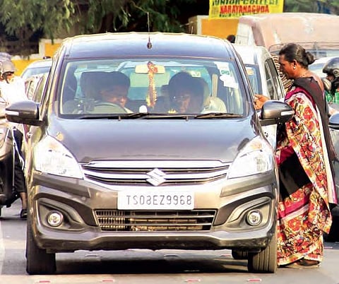 Crossdressers can be seen begging at the busy traffic signal near Secretariat junction at all times of the day, in Hyderabad on Monday | sathya keerthi