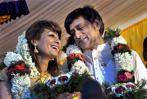 File photo dated August 22 2010 shows Congress MP Shashi Tharoor with his wife Sunanda Pushkar at his ancestral home in Elavanchery village at Palakkad district of Kerala. (Photo | PTI)