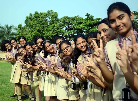 Students of Buxi Jagabandhu English Medium School at Bhubaneswar celebrating their success on Tuesday. (EPS | Biswanath Swain)