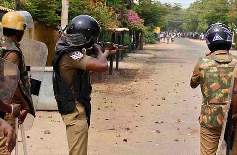 A police personnel shoots at the protesters protesting against the copper smelting plant in Thoothukudi. (Photo | Karthik Alagu)