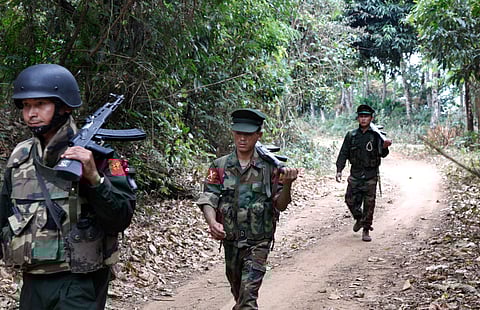 Kachin Independence Army fighters walk in a jungle path from Mu Du front line to Hpalap outpost in an area controlled by the rebels in northern Kachin state, Myanmar. (File | AP)