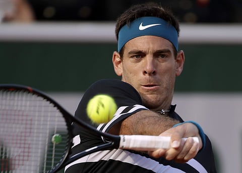 Juan Martin del Potro slams a forehand to Nicolas Mahut during their first round match of the French Open tournament at the Roland Garros stadium. | AP