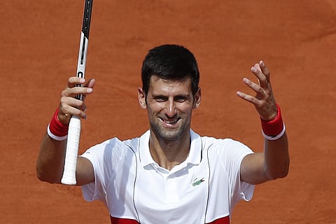 Serbia's Novak Djokovic celebrates winning his second round match of the French Open tennis tournament against Spain's Jaume Munar at the Roland Garros stadium in Paris, France, Wednesday, May 30, 2018. (AP)