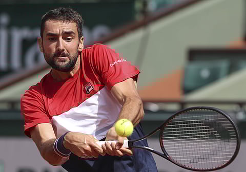 Croatia's Marin Cilic returns a shot against Poland's Hubert Hurkacz during their second round match of the French Open tennis tournament at the Roland Garros stadium in Paris, France, Thursday, May 31, 2018. | AP