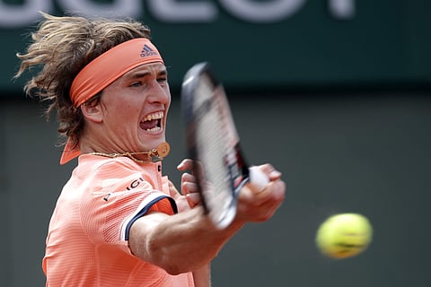 Alexander Zverev returns the ball to Dusan Lajovic during their second round match of the French Open tournament at the Roland Garros stadium. | AP
