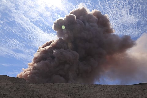In this photo released by U.S. Geological Survey, a plume of ash rises from the Puu Oo vent on Hawaii's Kilaueaa Volcano. (AP)