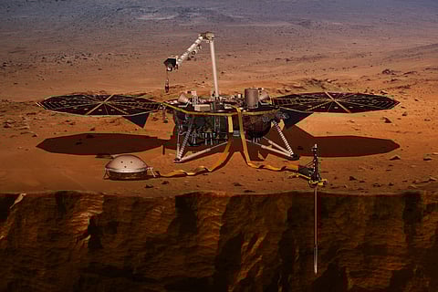 This illustration made available by NASA in 2018 shows the InSight lander drilling into Mars. InSight, short for Interior Exploration using Seismic Investigations, Geodesy and Heat Transport, is scheduled to launch from Vandenberg Air Force Base on Saturd