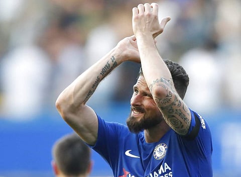Chelsea's Olivier Giroud celebrates after winning the English Premier League match between Chelsea and Liverpool at Stamford Bridge stadium in London. (AP)